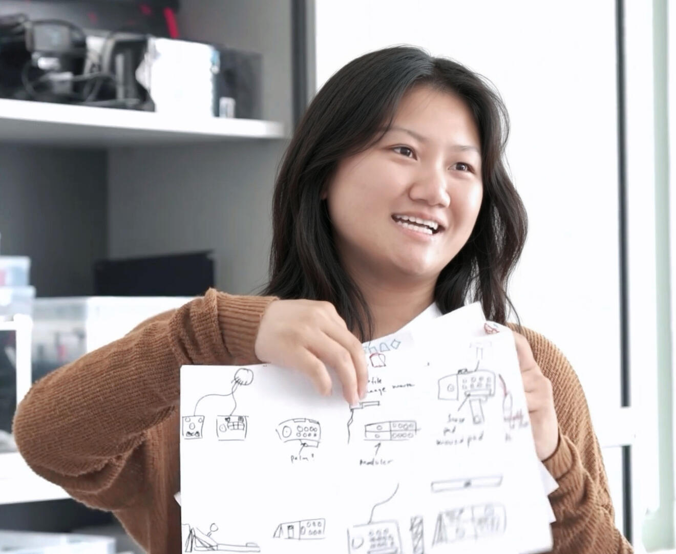 Victoria presenting initial sketch ideas for project.